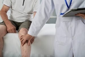 Orthopedic doctor examining a patient knee